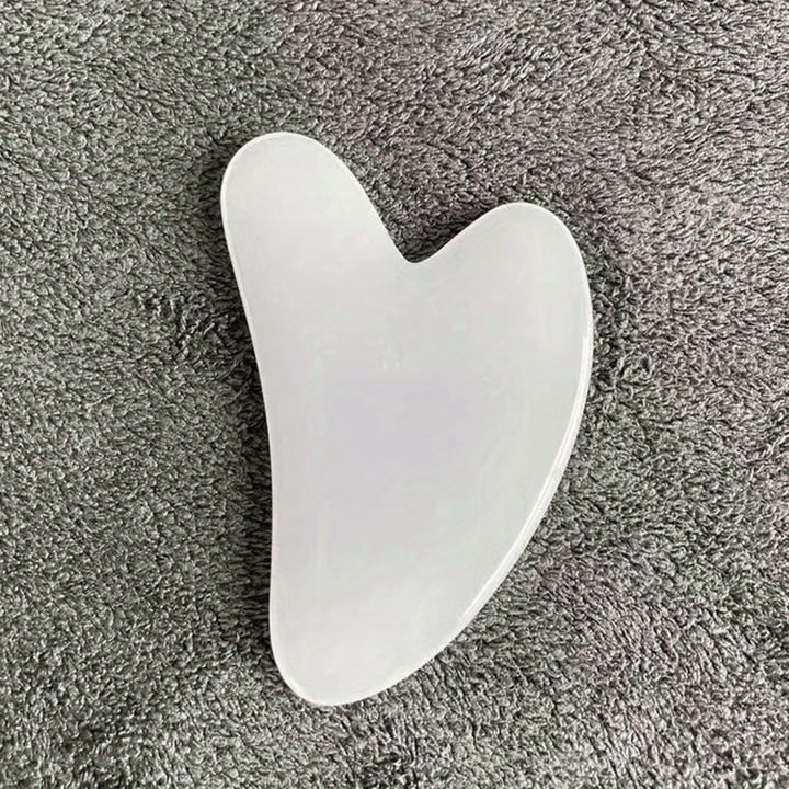 Heart-shaped gua sha for tension relief