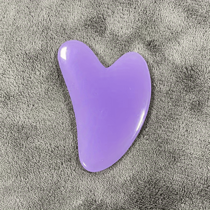 Pastel pink gua sha for skincare routine